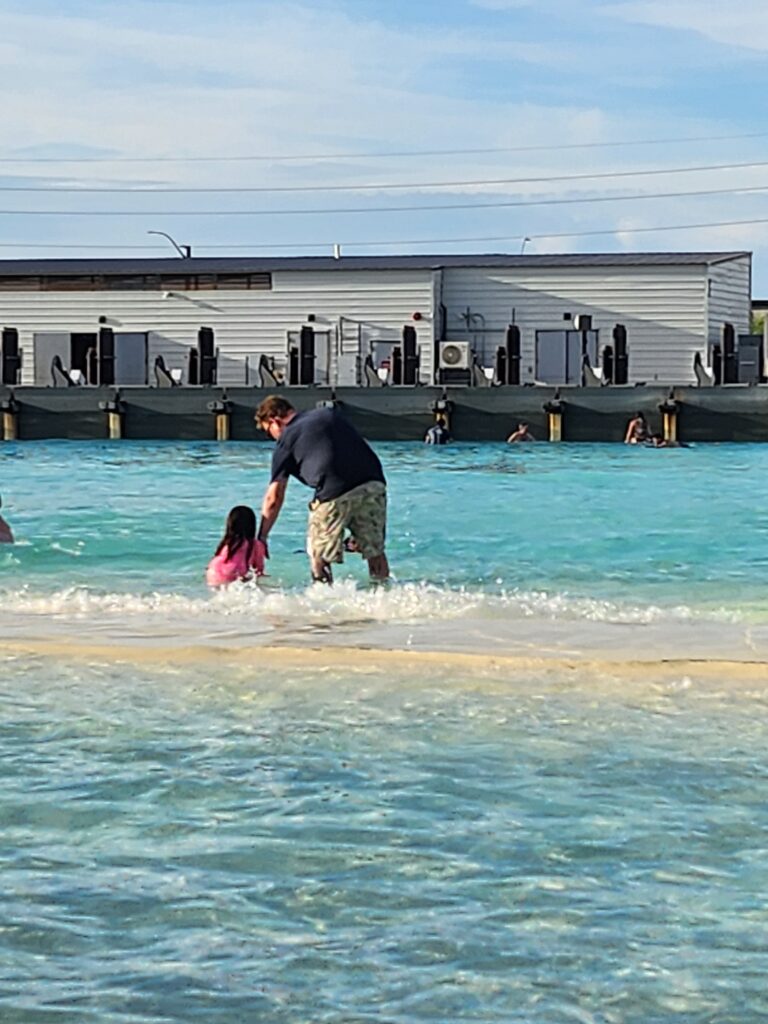 father and child revel surf